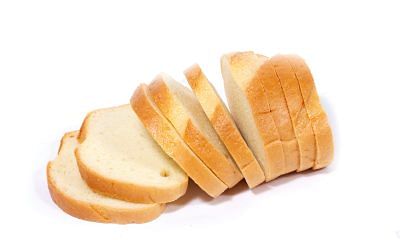 Slices of fresh bread arranged on a white background.