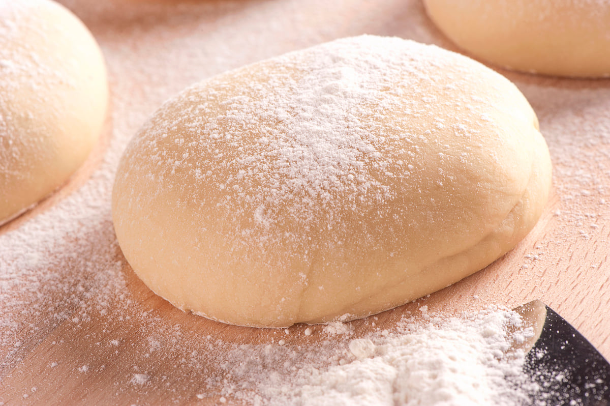 Freshly kneaded dough with flour dusting